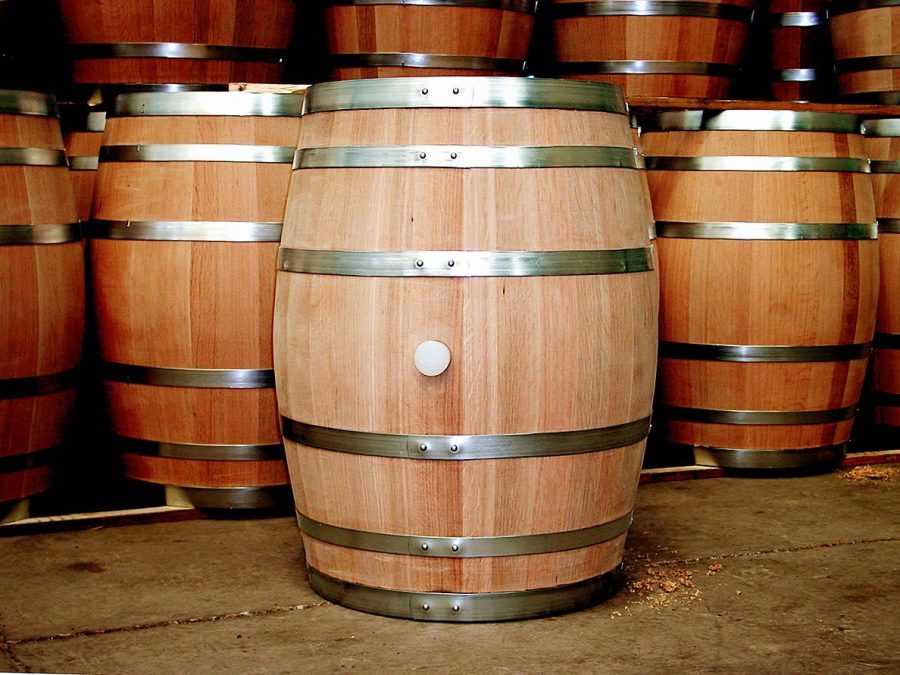 Pale unused oak barrels showing fresh wood grain in a cooperage